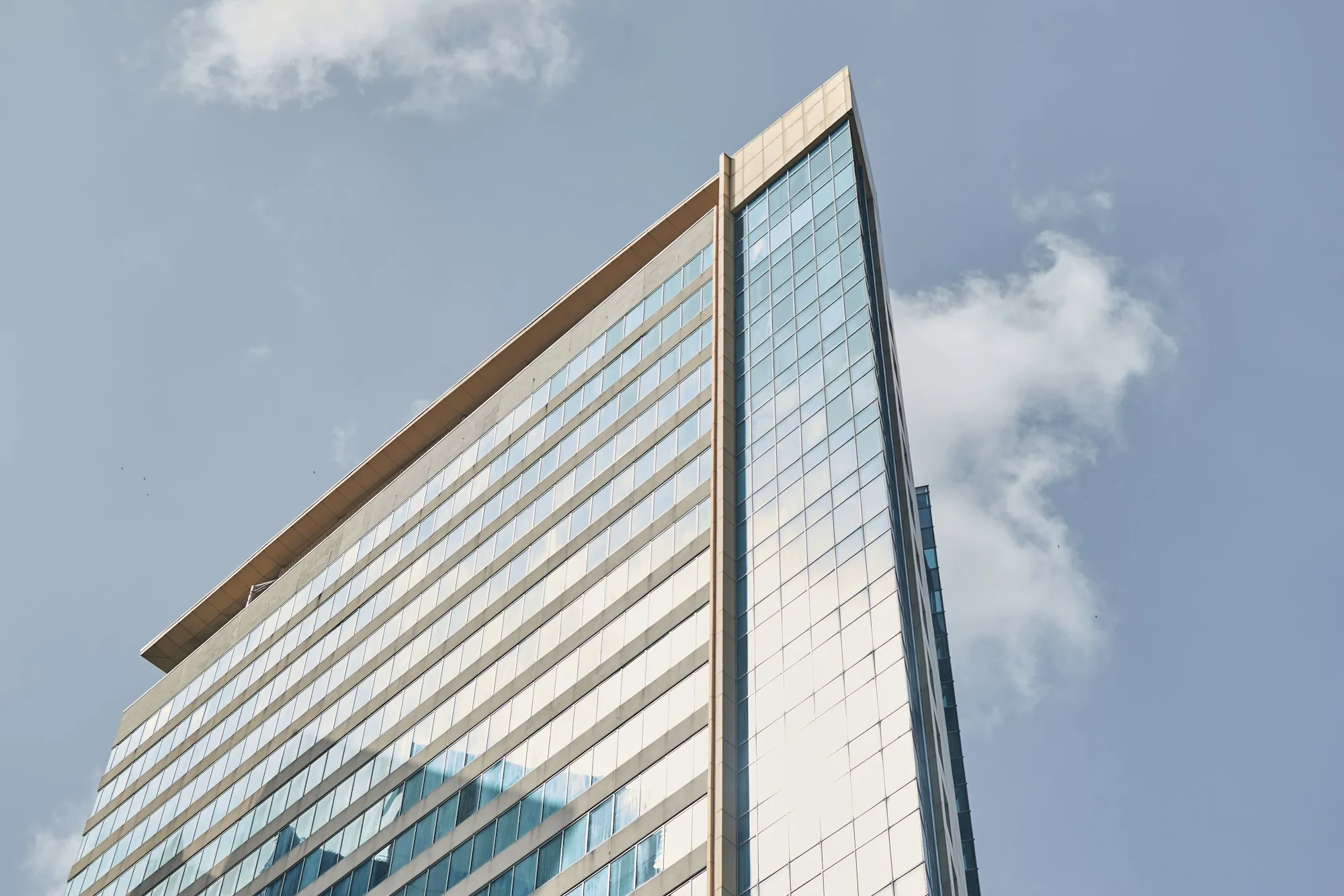 Modern office building corner with glass facade
