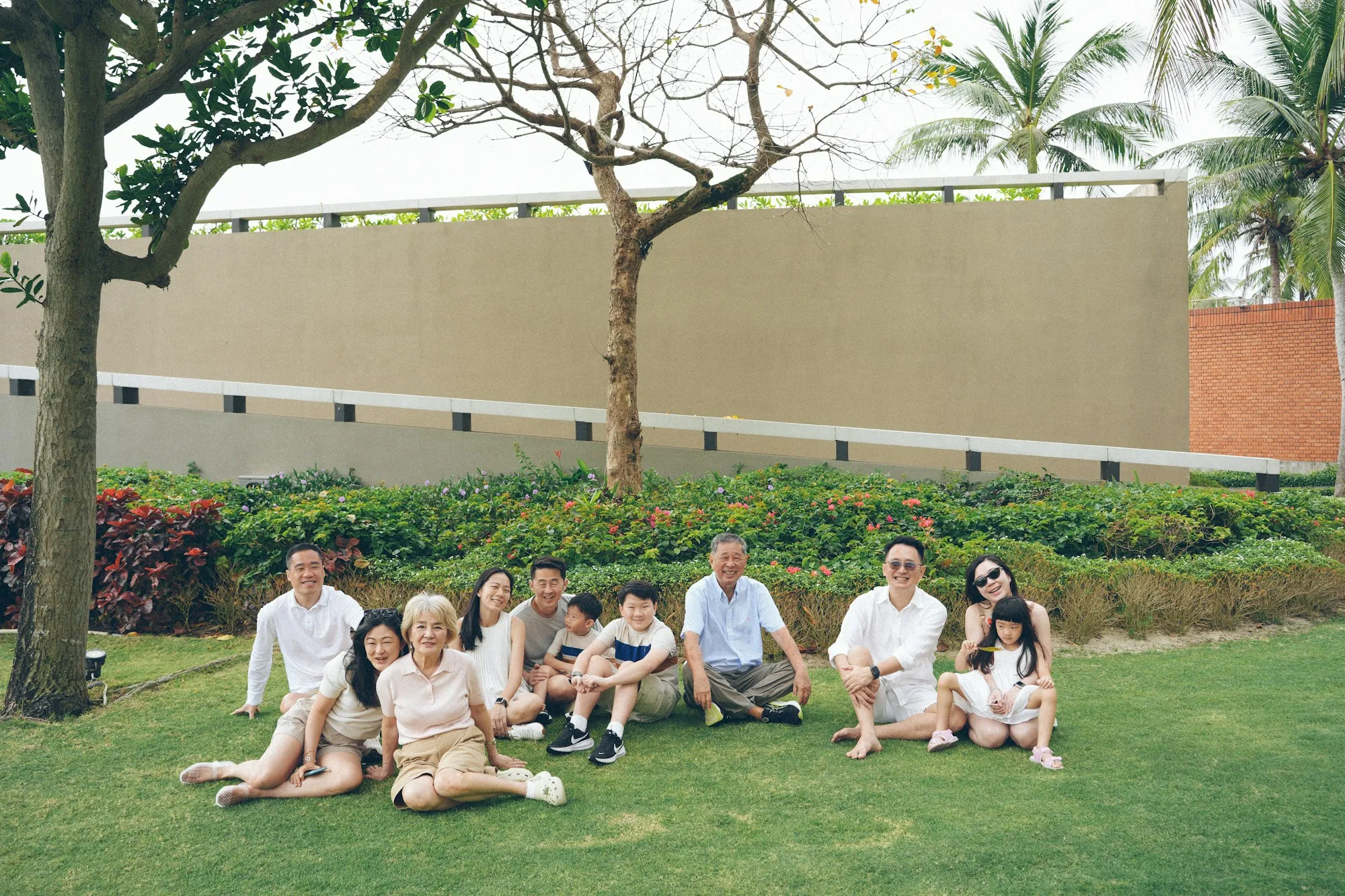 Extended family sitting together on a lawn